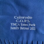 Blue fleece blanket embroidered YMCA Estes Park 2021