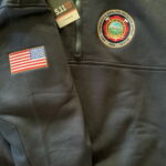 Black jacket with American flag and fire patch