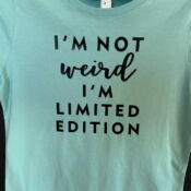 Teal shirt: "Not weird, limited edition